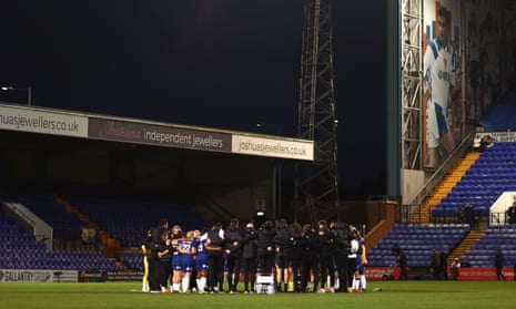 The players of Chelsea form a huddle at full-time following the team's defeat in the Barclays Women’s Super League match against Liverpool.