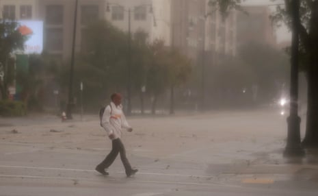 A man walking in heavy rain.