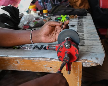 A player sharpens his darts.