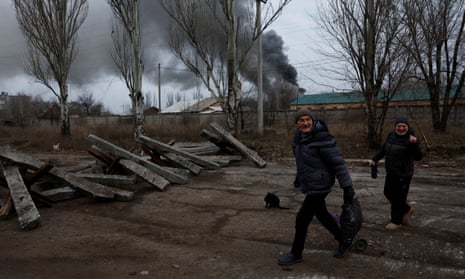 People near smoking building