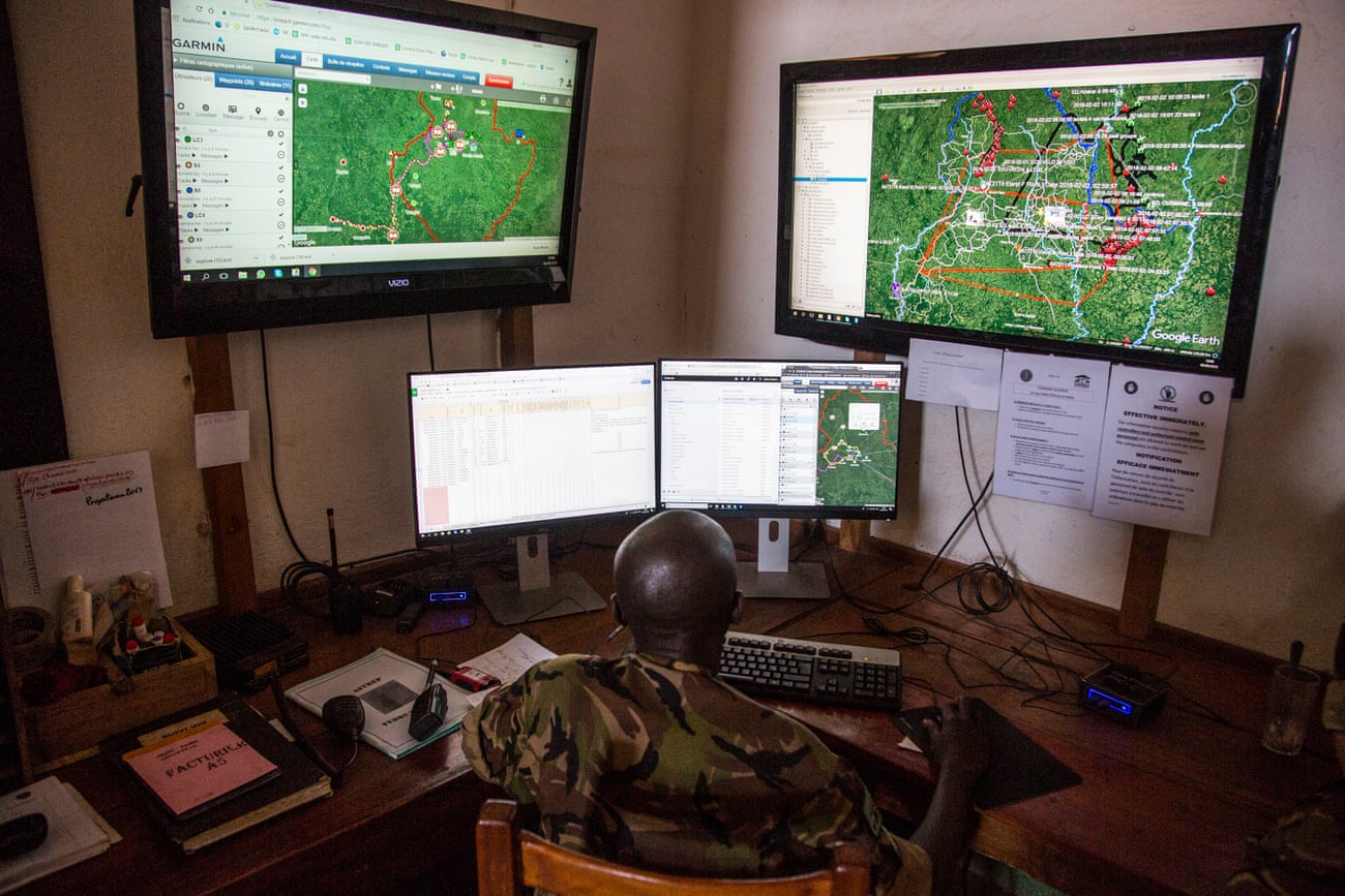 Davis, a Chinko employee, monitors various screens in the park’s control room where software plots ranger movement, bushfires and other crucial information on a Google Earth map.