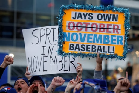 Blue Jays fans display signs outside Rogers Centre before Game 7.
