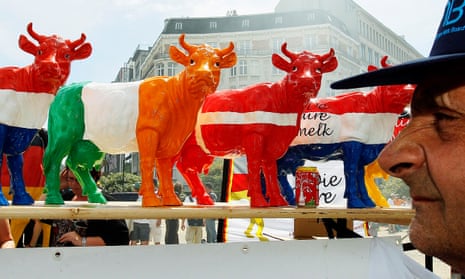 Models of cows at a farmers’ protest against low milk prices, outside the European Council headquarters in Brussels