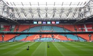 A general view inside the stadium as members of ground staff prepare the pitch.