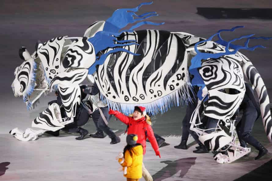 A white tiger performs during the Opening Ceremony