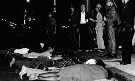 Armed police forced people to lie face down in the street during the Watts riots, Los Angeles, in August 1965.