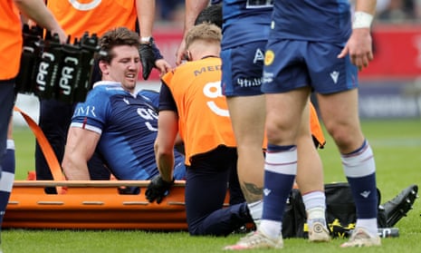 Ben Curry leaves the field on a stretcher after suffering a hamstring injury against Leicester.