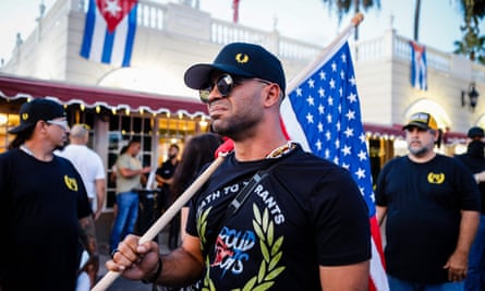 Henry ‘Enrique’ Tarrio holds an American flag during a protest in Miami, Florida, in 2021.