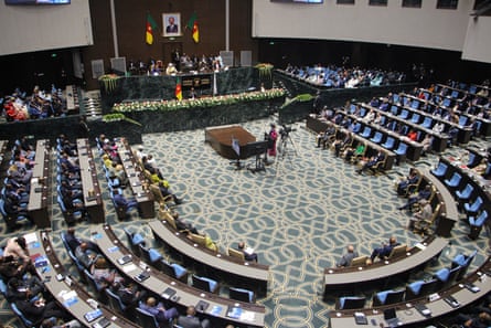 Elevated view of members of the national assembly sitting during a parliamentary session