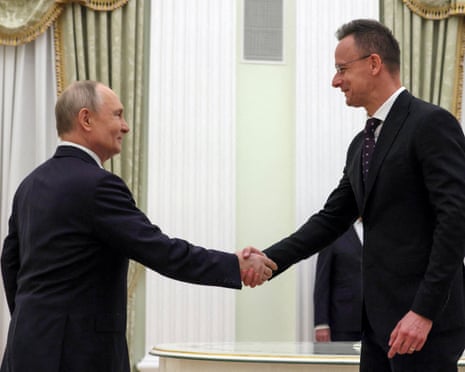 Russian president Vladimir Putin shakes hands with Hungarian foreign minister Peter Szijjarto during a meeting in Moscow, Russia.