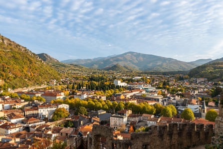 Town in valley with lovely clouds and distant hills