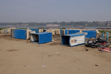 Portable toilet buildings lie on their side