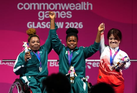 Nigeria’s silver medal winner Esther Oyema (left) and gold medal winner Esther Nworgu celebrate with England’s bronze medal winner Olivia Broome following the Women's Lightweight Group A Para Powerlifting.