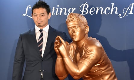 Japan’s 2015 Rugby World Cup hero Ayumu Goromaru alongside a lifesize bronze statue.