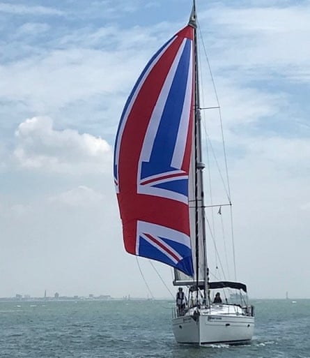 yacht with a union jack sail at sea