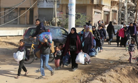 Palestinians including children leaving their homes in al-Bureij.