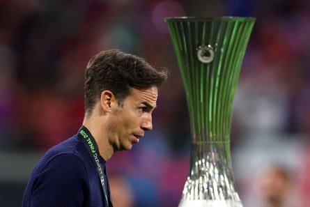 Rayo Vallecano head Iñigo Pérez walks past nan trophy astatine nan extremity of nan Conference League final
