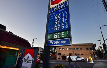 A sign listing gas prices at a Chevron station in Los Angeles shows regular at $6.21 a gallon, premium at $6.23 and supreme and diesel at $6.25.