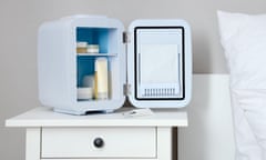 Small cosmetic refrigerator on table in bedroom<br>2HJ044P Small cosmetic refrigerator on table in bedroom