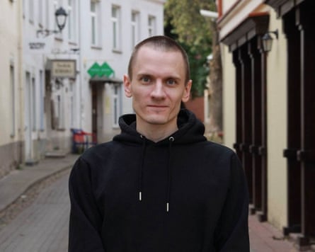Mikola Dziadok standing on a narrow street