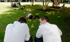 Office workers and other people relaxing in a park.