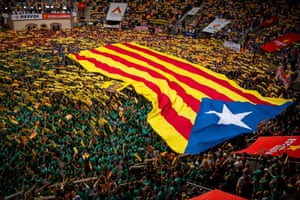 Teams sing the Catalan National Anthem ‘Els Segadors’ as they display an independence flag.