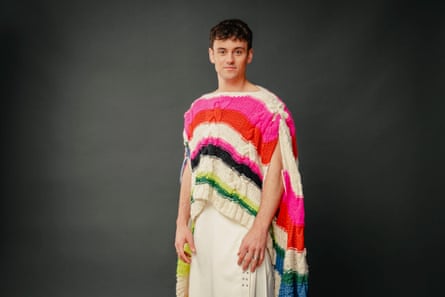 Tom Daley in a multicoloured shawl/smock.