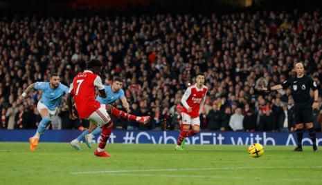 Arsenal's Bukayo Saka scores their equaliser from the penalty spot during the F.A. Premier League match between Arsenal and Manchester City.