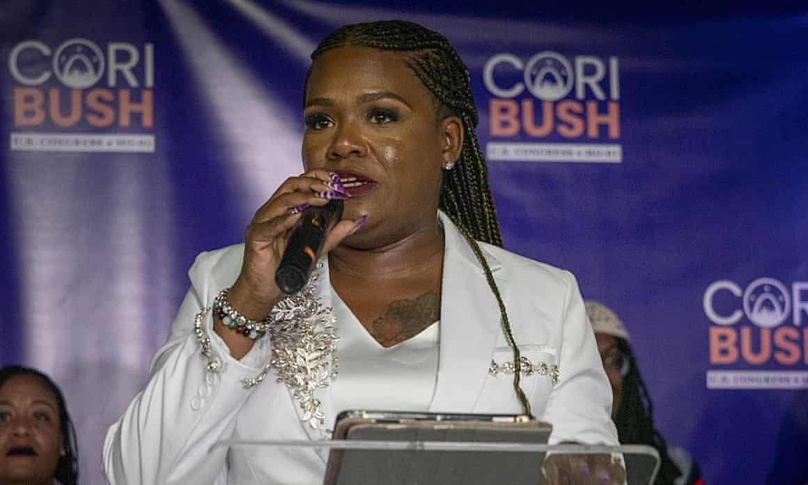 Cori Bush talking into microphone.