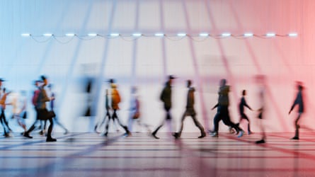 Long exposure image of people walking in a pedestrian passage.