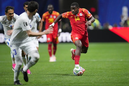 Noah Sadiki dribbles towards a defender