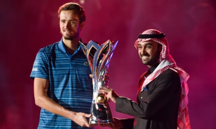 Daniil Medvedev receives a trophy after winning the Diriyah Tennis Cup in December 2019