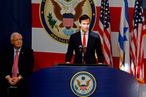 David Friedman, the US ambassador to Israel, listens as Jared Kushner delivers a speech during the opening ceremony