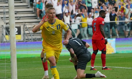 Oleksandr Zinchenko celebrates after putting Ukraine in front against England.