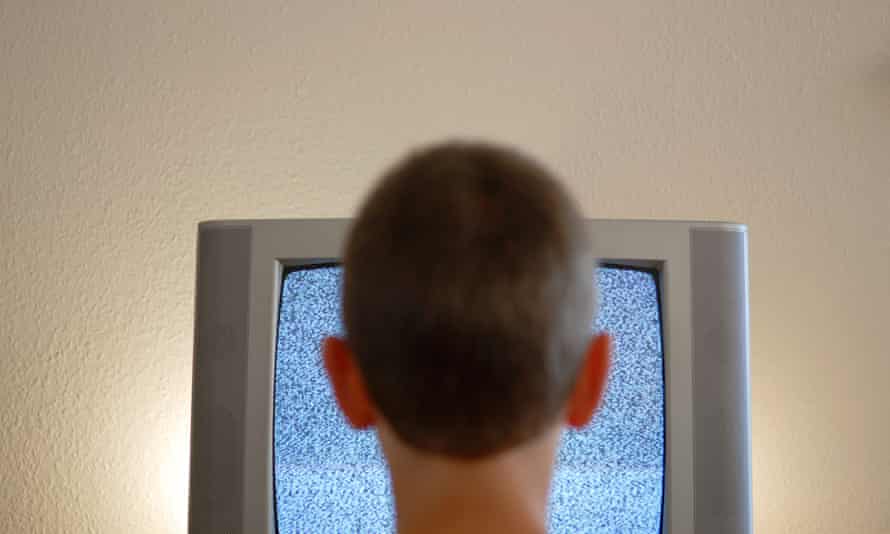 Boy watching static on TV