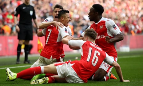 Arsenal players celebrate the winning goal at Wembley, scored by Alexis Sánchez, second left. 