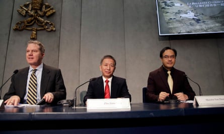 Vatican’s spokesman Greg Burke, Secretary General of China Culture Industrial Investment Fund Zhu Jiancheng, and Chinese artist Yan Zhang sit during a press conference at the Vatican.