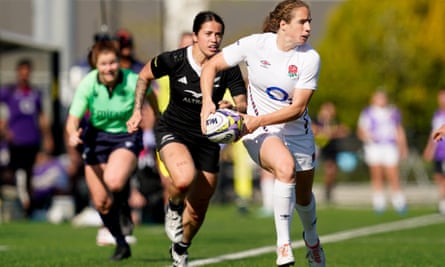 England’s Abby Dow looks for a pass while being chased down by Katelyn Vaha’akolo.