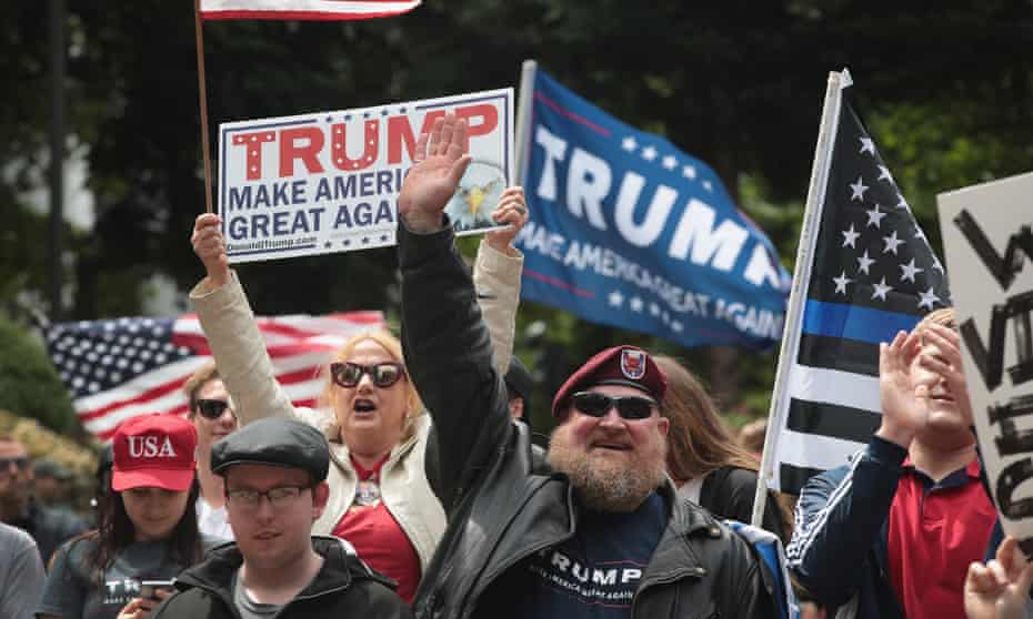 Pro-Trump demonstrators at the rally on Sunday. The event sparked controversy in the wake of a racially charged killing. 