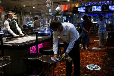 Casino staff clean surfaces at the Rialto casino on 15 August, 2020 in London, England. Enhanced safety and cleaning measures are put in place as Grosvenor Casinos prepare to reopen their entertainment venues for the first time since the coronavirus lockdown.