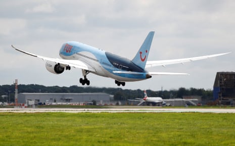 A Boeing 787 of the travel company TUI takes off from the southern runway at Gatwick Airport in Crawley.