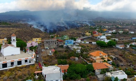 Smoke rises from lava on La Palma as residents are forced to evacute their homes.