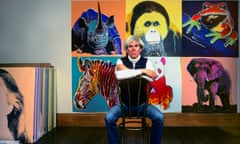 Andy Warhol with paintings from his Endangered Species series  at the Factory in 1983