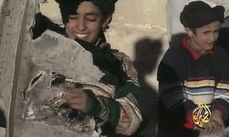 An image from 2001 video broadcast by Al-Jazeera showing a boy, identified as Hamza bin Laden, holding what the Taliban says is a piece of US helicopter wreckage in Ghazni, Afghanistan.