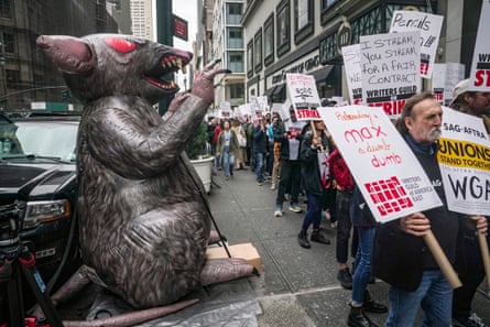 A giant inflatable rat, a symbol of organized labor, is displayed as writers picket outside Peacock NewFronts in New York.