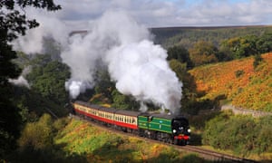 A steam train on the North York Moors Railway passes Thomason Foss.
