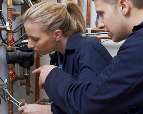 an apprentice working on a boiler under instruction