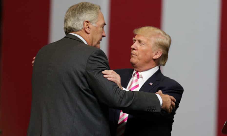 Luther Strange and Doanld Trump embrace after Trumps’s speech at the Von Braun Centre in Huntsville on Friday.