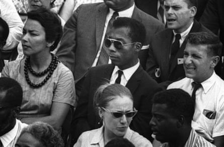 James Baldwin sitting in a crowd, in a still from I Am Not Your Negro, Peck’s 2016 documentary