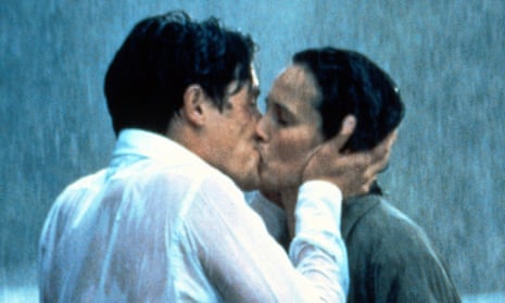 Charles and Carrie kiss in the rain in a scene from the film, Four Weddings and a Funeral